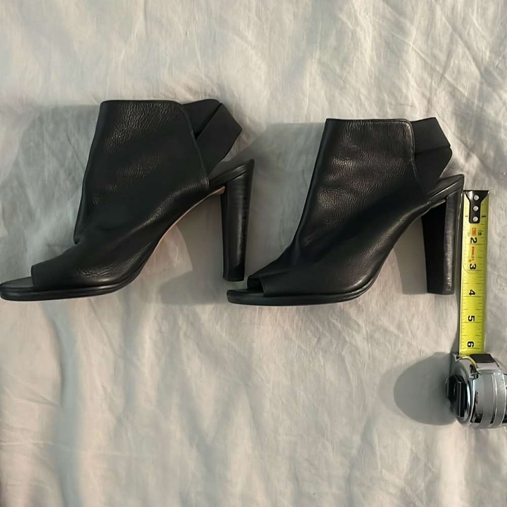 Stuart Weitzman black leather peep toe heels with elastic heel straps, size 9
